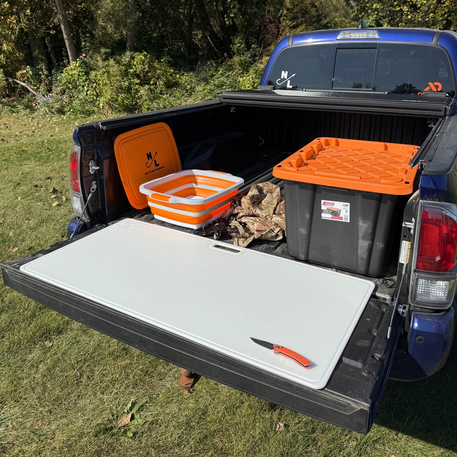 Big Game Cutting Board on tailgate — hero product photo